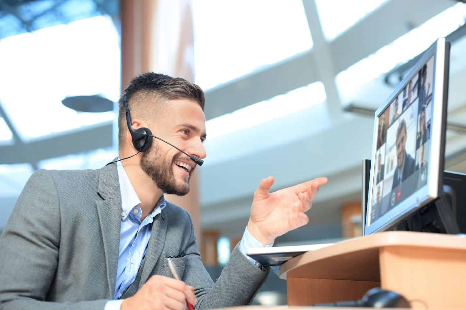 Male person perform interpreting and translation services during video conference